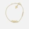 Guess Mainline Women's Modern Love Central Knot Bracelet Yellow Gold 1 Guess Mainline Women's Modern Love Central Knot Bracelet Yellow Gold -Culture Kings 09001489 YY067 default 0010