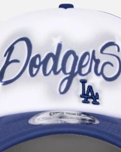 New Era Los Angeles Dodgers 'Airbrush' 9FORTY A-Frame Trucker Snapback White/OTC 12 New Era Los Angeles Dodgers 'Airbrush' 9FORTY A-Frame Trucker Snapback White/OTC -Culture Kings 198059580397 default 0050 cf6b5b5f 6a3b 40ec 875a a1cc71bacefe